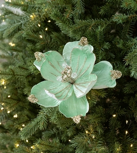 Detail of mint green velvet artificial Christmas flower with gold glitter edges on tree