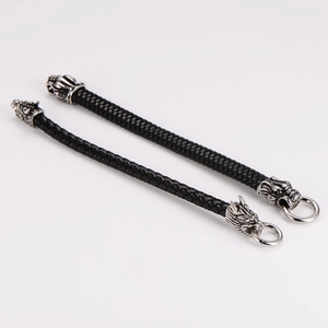 Handcrafted leather braided bracelet with silver viking dragon heads for men