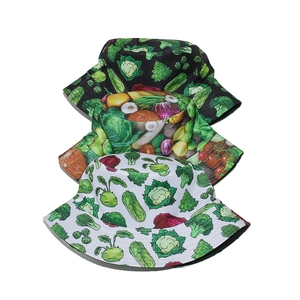 Three vegetable print bucket hats in black and white with realistic garden patterns