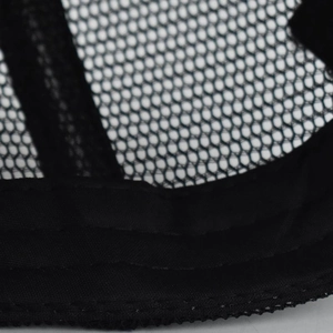 Detailed macro view of black mesh baseball cap interior with reinforced stitching seams