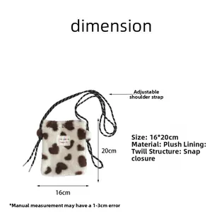 Detail view of plush heart crossbody bag with 16x20cm size and adjustable strap specs
