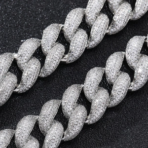 Macro shot of 18mm silver Cuban link chain with pave-set sparkling zircon stones