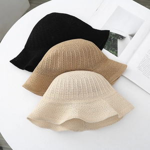 Three hollow knit bucket hats in black, khaki, and cream colors for sun protection