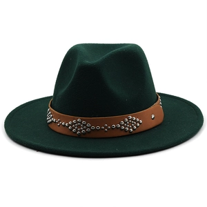 Detail of dark green wool fedora hat featuring a brown leather belt with silver rivets