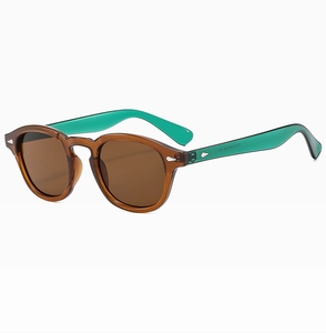 Detail of vintage round sunglasses showing brown frame and teal contrast temple interior