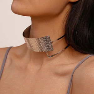 Close-up of a silver hammered texture choker with geometric metal layers for women