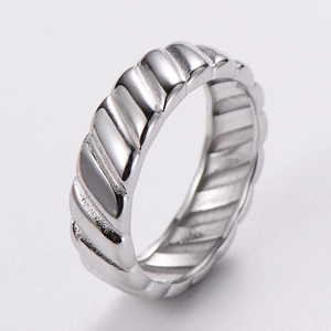 Macro detail of the silver rib-style croissant twisted ring band with metallic texture