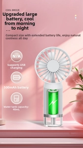 Internal view of a handheld misting fan showing 500mAh battery and 40mL water tank detail