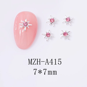 Detailed view of silver star cross nail charm with pink rhinestone and 7x7mm dimension