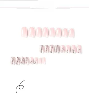 Detail view of 24pcs pink French tips press-on nails with white edges and silver glitter