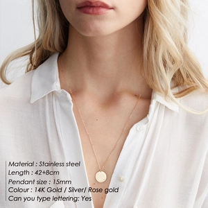 Multilayer stainless steel necklace with 15mm round pendant on model neck