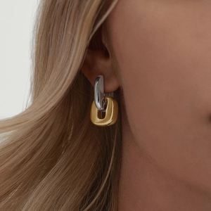 Modern two-tone 18K gold and silver stainless steel interlocking oval link earrings