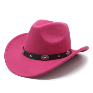 Detail of rose pink felt cowboy hat with leather band and metallic floral rivets