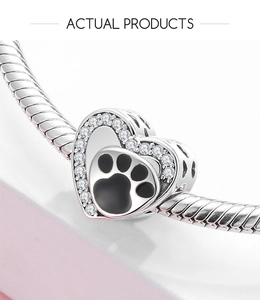 Detailed view of S925 silver heart charm with black paw print and sparkling crystals