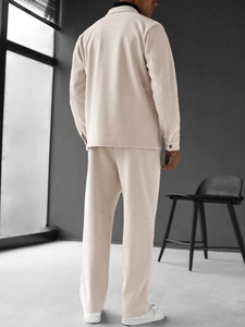 Detailed back view of men's beige waffle knit jacket and matching trousers set