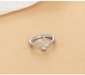 Detailed macro shot showing S925 hallmark, zircon stone, and letter j on silver ring