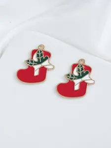 Detail of red enamel Christmas stocking charms with holly leaf and gold trim