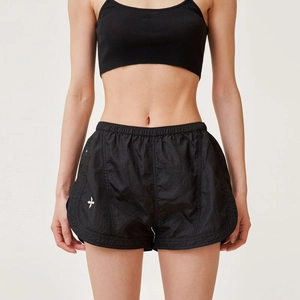 Women's black athletic set with viper skin texture sports shorts and matching tank top