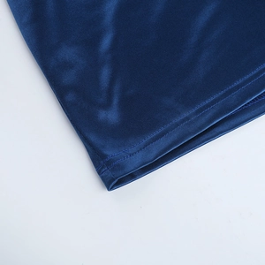 Detailed view of the double-needle stitched hem on a navy blue sleeveless bodycon dress