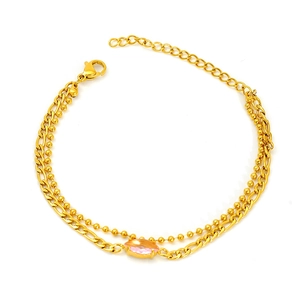 Detail of double-layer gold titanium steel bracelet with pink marquise zircon and lobster clasp