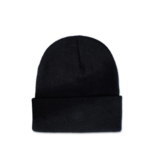 Close-up of black knitted beanie featuring fine knit texture and a classic fold-over cuff