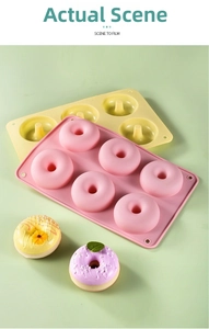 Detailed close-up of 6-cavity silicone donut mold in pink and yellow for DIY baking