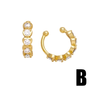 Gold U-shaped ear cuffs with heart-shaped white cubic zirconia in minimalist style