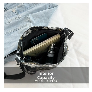 Internal capacity of the floral skull pattern bucket bag with phone and books inside