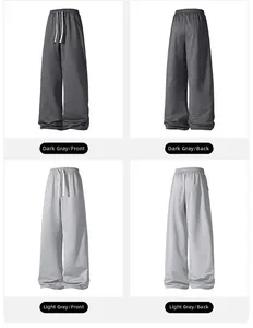 Detail of adjustable drawstring waistband on loose fit straight leg joggers