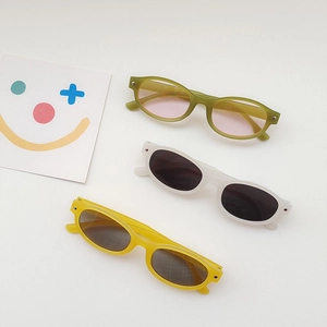 Kids retro cat-eye sunglasses set in olive green, white, and bright yellow frames