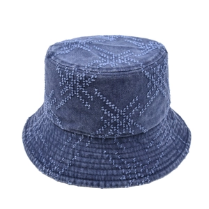Navy blue denim bucket hat with distressed star patterns and a vintage flat top design