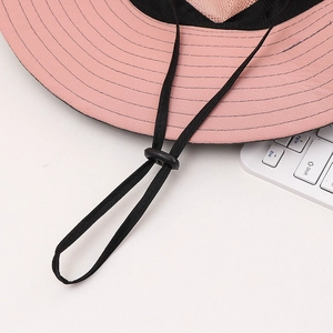 Detail view of pink sun hat with adjustable drawstring and breathable mesh lining