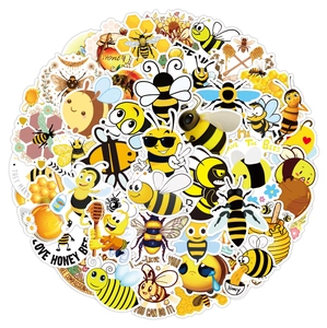 Macro view of waterproof bee stickers with sunflower and honey motifs on white surface