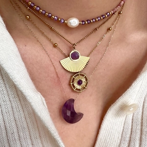 Layered 14K gold necklace set with purple amethyst moon and sunburst compass pendants
