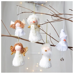 Detailed view of white plush angel and snowman Christmas ornaments with gold sequins