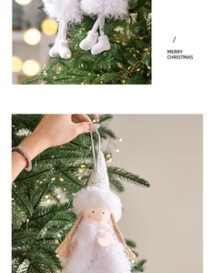 Detailed view of plush white Christmas angel doll ornament hanging on a festive tree