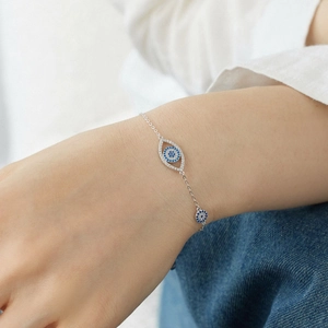 Macro detail of S925 sterling silver evil eye bracelet with blue CZ zircon stones