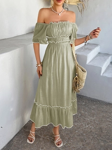 Detail of off-shoulder sage green bohemian dress with ruffle trim and elastic waist