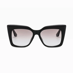 Front view of large cat-eye sunglasses featuring glossy black frames and gradient grey lenses