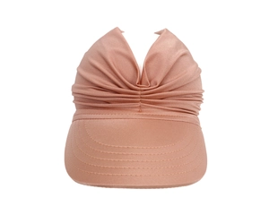 Detail of elegant rose gold sun visor showing textured fabric and spiral stitching on brim