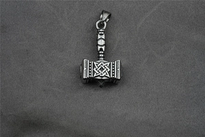 Detailed view of Viking Mjolnir pendant with Valknut engraving in matte finish
