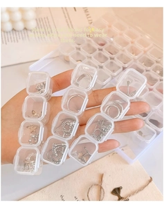 Clear acrylic multi-slot jewelry box for rings and earrings with portable design