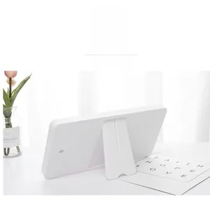 Detail view of the minimalist white frame back with a sturdy folding adjustable bracket