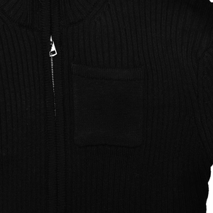 Detailed view of the thick ribbed knit fabric and silver metal zipper on the black jacket