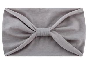 Detail of grey knotted headband showing soft cotton blend fabric texture for sports