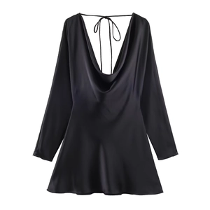 Detail of the elegant cowl neck and silky satin texture on this black mini dress