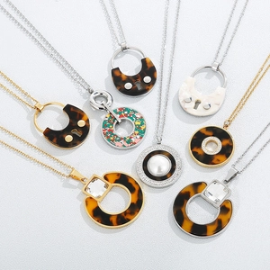 Minimalist stainless steel necklaces with tortoise resin and crystal pendants