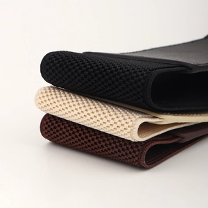 Close-up of woven elastic fabric texture in black beige and brown for waist belts