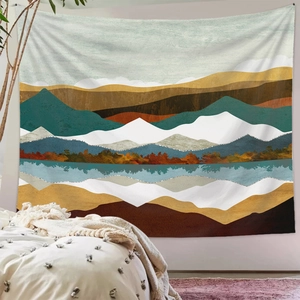 Detailed view of an abstract mountain tapestry hanging on a minimalist bedroom wall