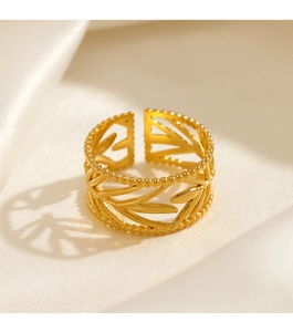 Detailed macro view of an adjustable gold-plated leaf ring with beaded edge detailing